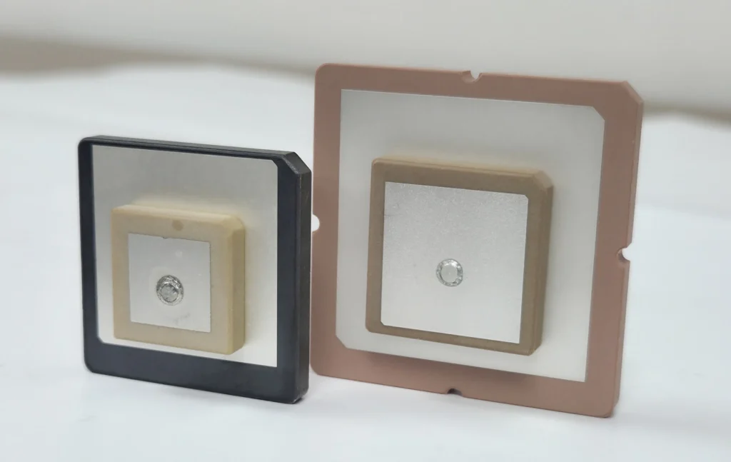 Two upright ceramic RFID antenna elements of different sizes