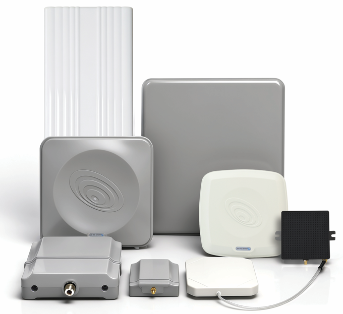 Four fixed RFID antenna housings displayed on a table